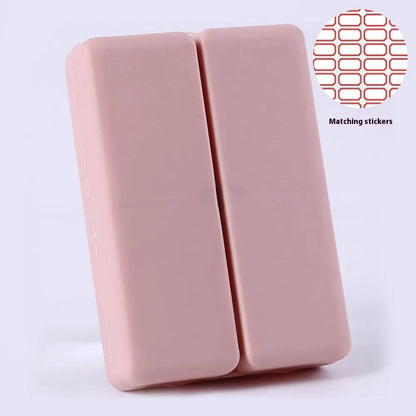 Blue foldable pill box with seven compartments and magnetic closure showing open and closed positions