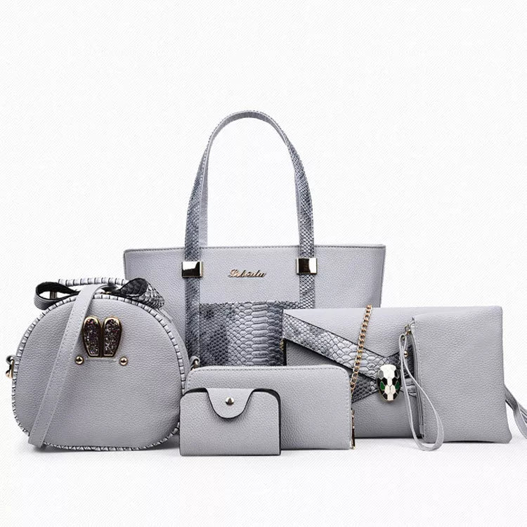 Women's shoulder bag with zipper closure and multiple pockets in light grey, black, off-white, and rose red