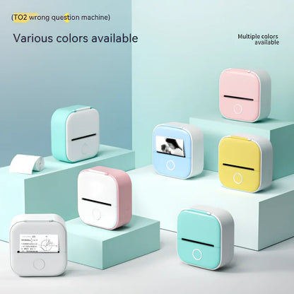 White mini pocket Bluetooth thermal label printer, 87x90x40mm size, with sample paper roll and USB charging