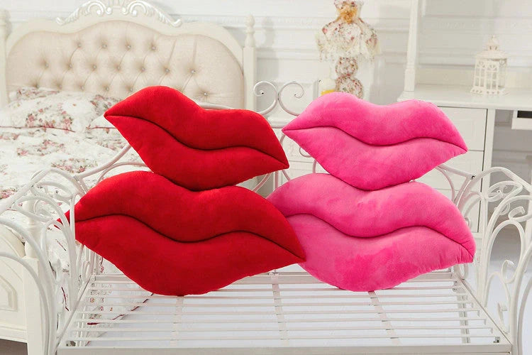 Adorable plush lip pillow for kids, available in pink and red, perfect for cuddling and play.