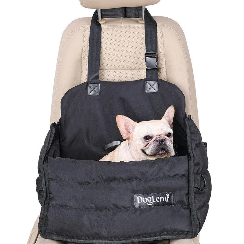 Black polyester dog car travel bag attached to car seat with seatbelt clip