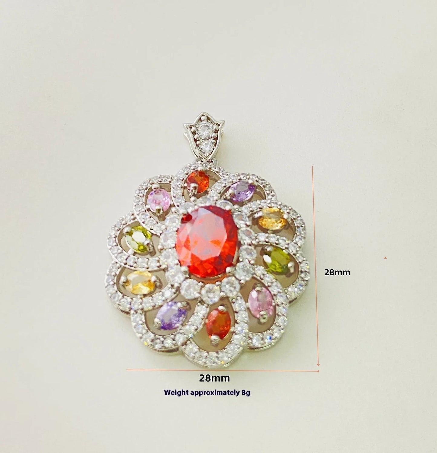Close-up of a women's flower-shaped pendant necklace with a colourful zircon stone in a choice of gold, champagne gold, or platinum colour finishes.