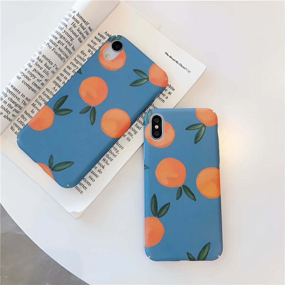 Orange plastic iPhone case with blue water pattern, retro back cover design.
