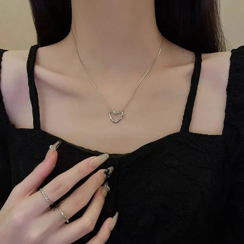Elegant titanium steel heart pendant necklace with adjustable chain in gold and silver colors