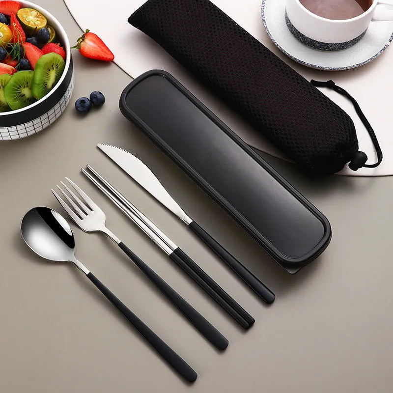 Gold and black stainless steel knife fork spoon set inside a grey mesh carrying bag.