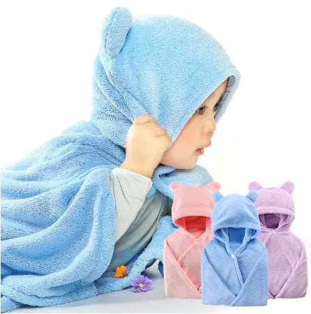 Blue hooded baby bath towel with dimensions 65cm by 110cm laid flat.