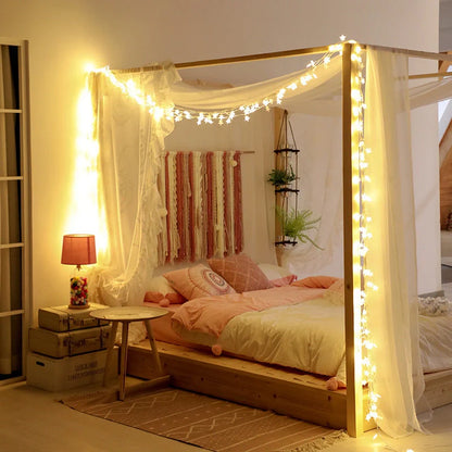 Battery-operated LED curtain garland with plastic stars and fur balls for festive decoration
