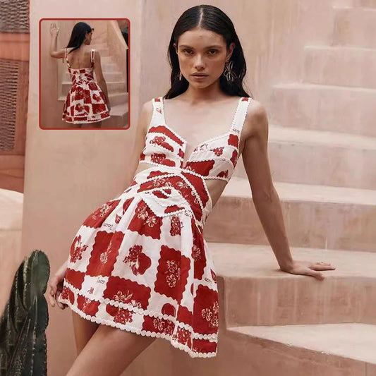 A beautiful red flower-patterned lace slip dress with a v-neck and waist cutout, perfect for summer fashion