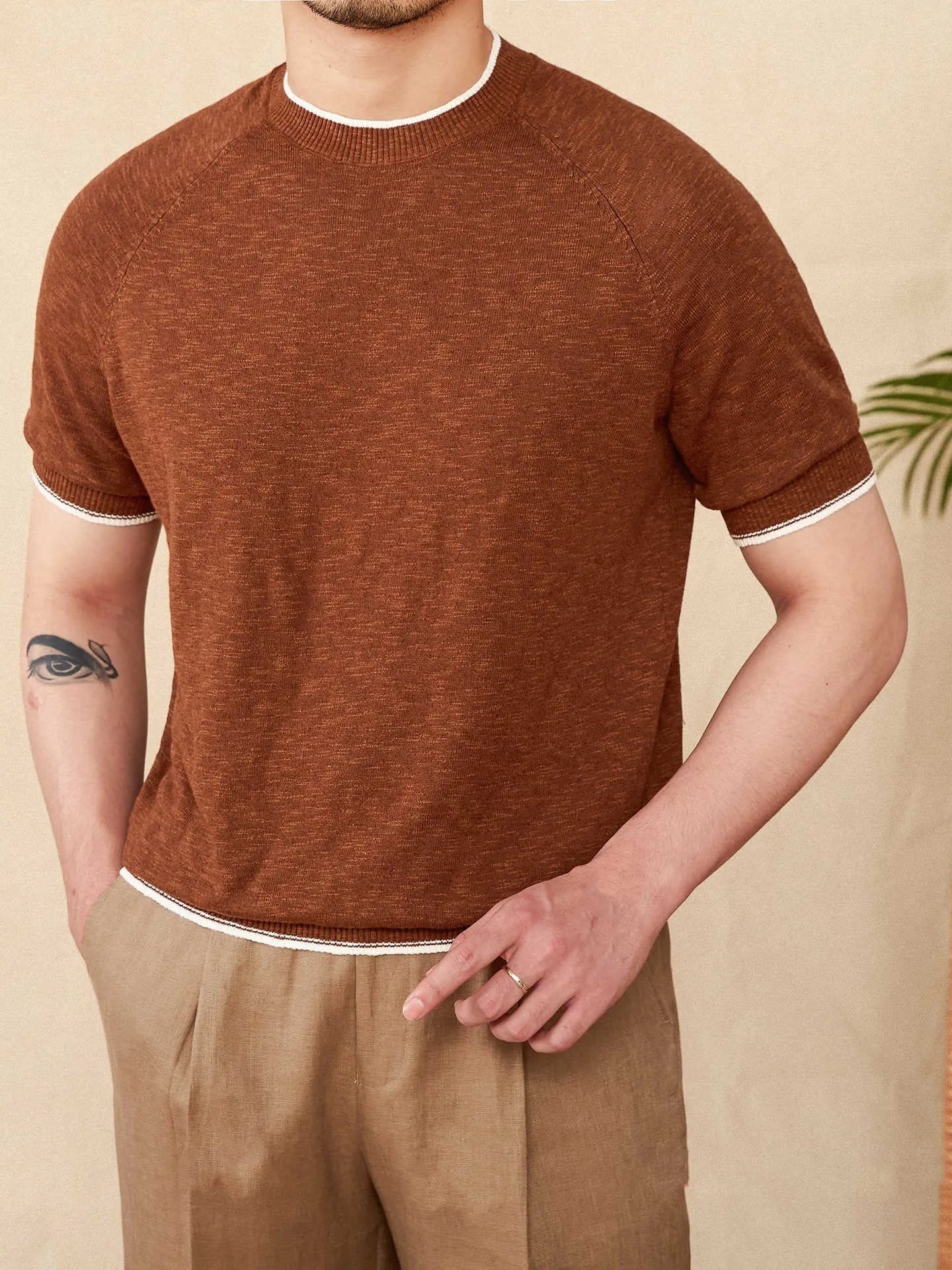 Brown linen-cotton blend casual T-shirt with round neck and short sleeves on a hanger