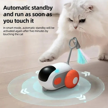 Blue remote control cat toy car with feather teaser on plastic chassis showing USB charging port