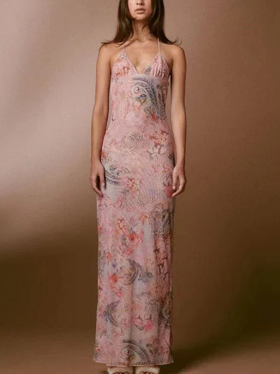 A stylish halter dress with a floral print and butterfly-inspired back, perfect for summer events and parties.