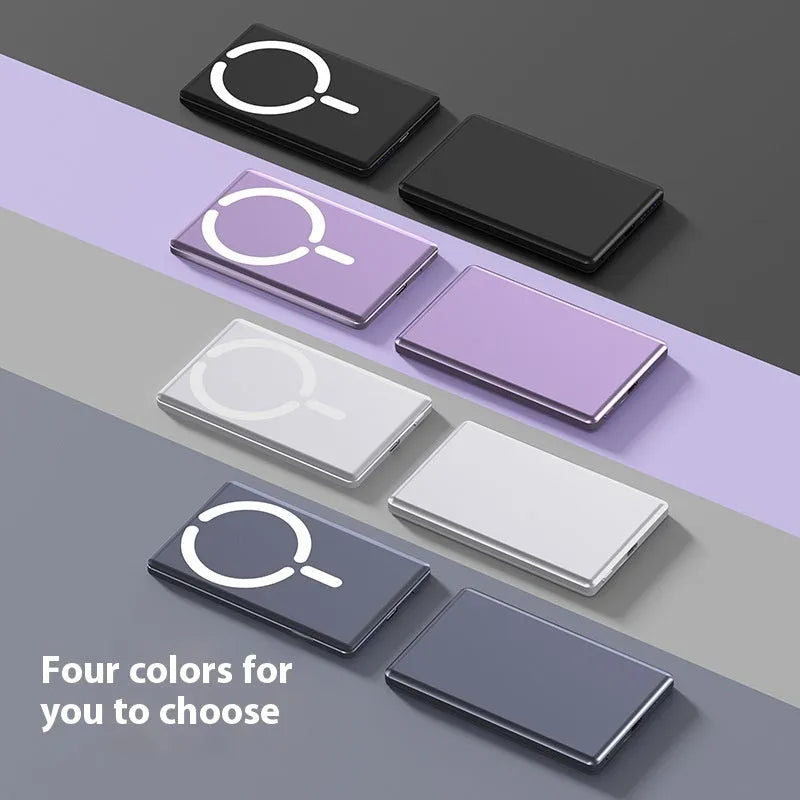 Slim dark grey magnetic power bank attached to the back of an iPhone, showing its thin profile and metallic finish.