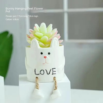 Ceramic hanging foot flowerpot with cartoon design for succulents on desktop