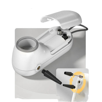 White handheld vacuum sealing machine with USB charging port on a kitchen counter.