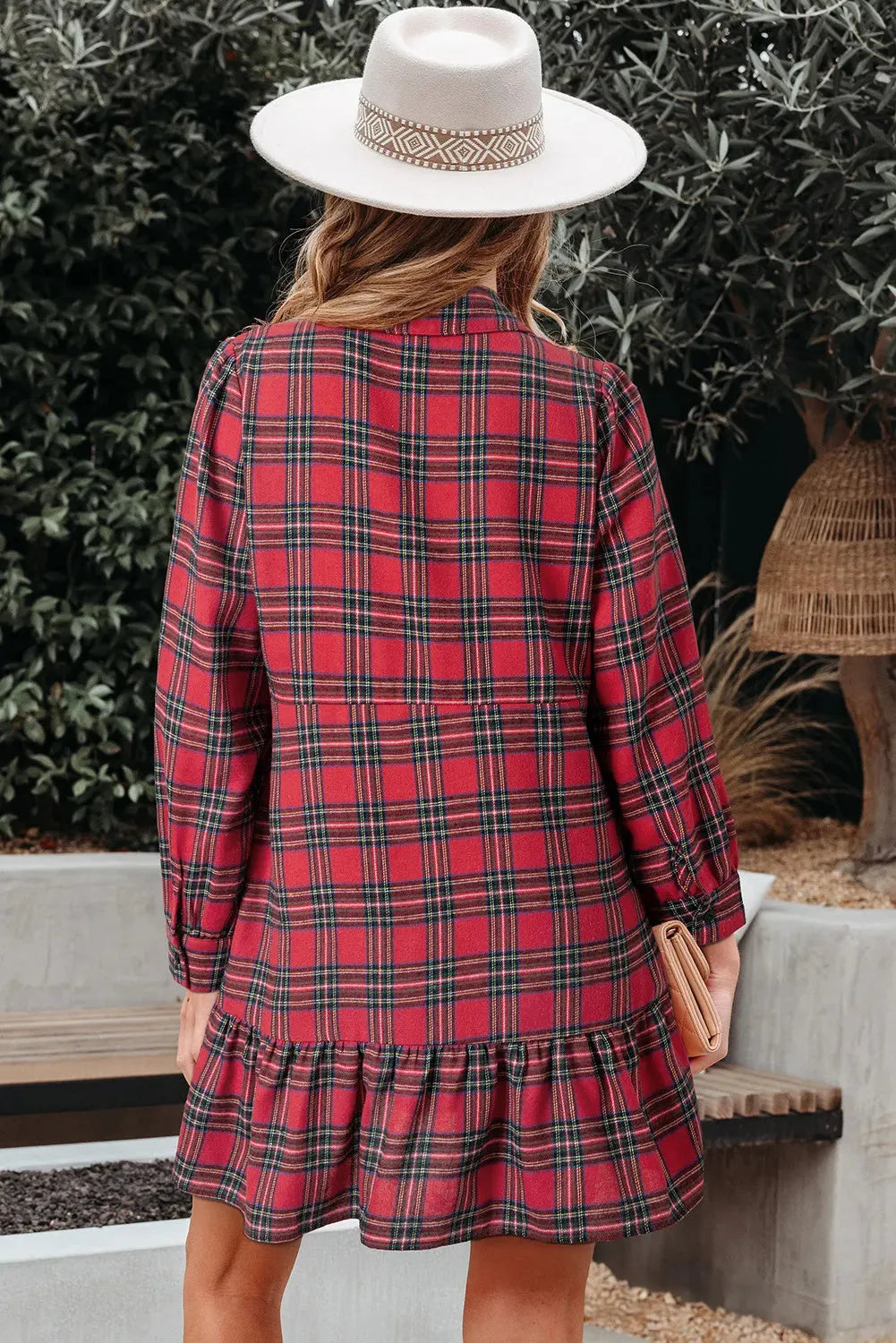 Red plaid mini dress with shirt collar, half buttons, long sleeves, and ruffle hem