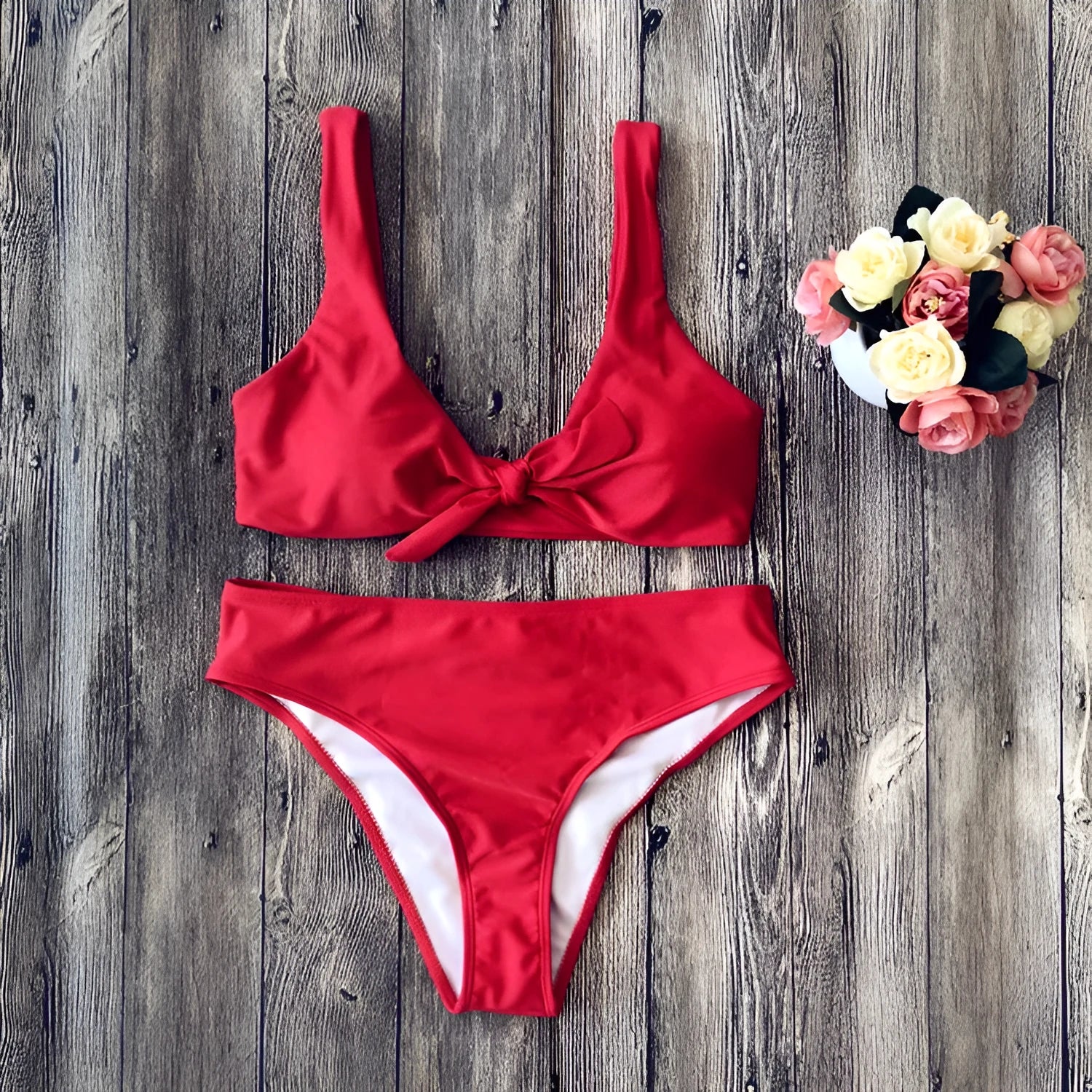Solid colour bikini top and bottom in seamless polyester fabric on a neutral background.