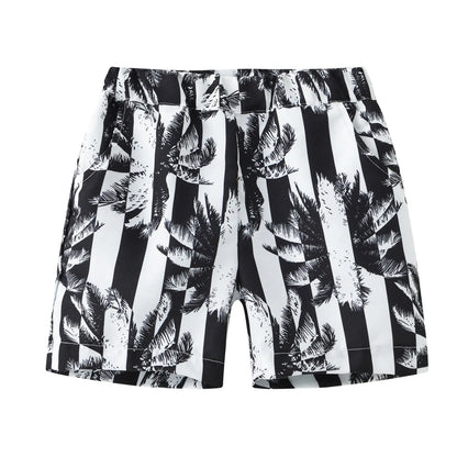 Multi-colour printed beach shorts with hairband belt on a mid-waist, shown in a casual summer style.