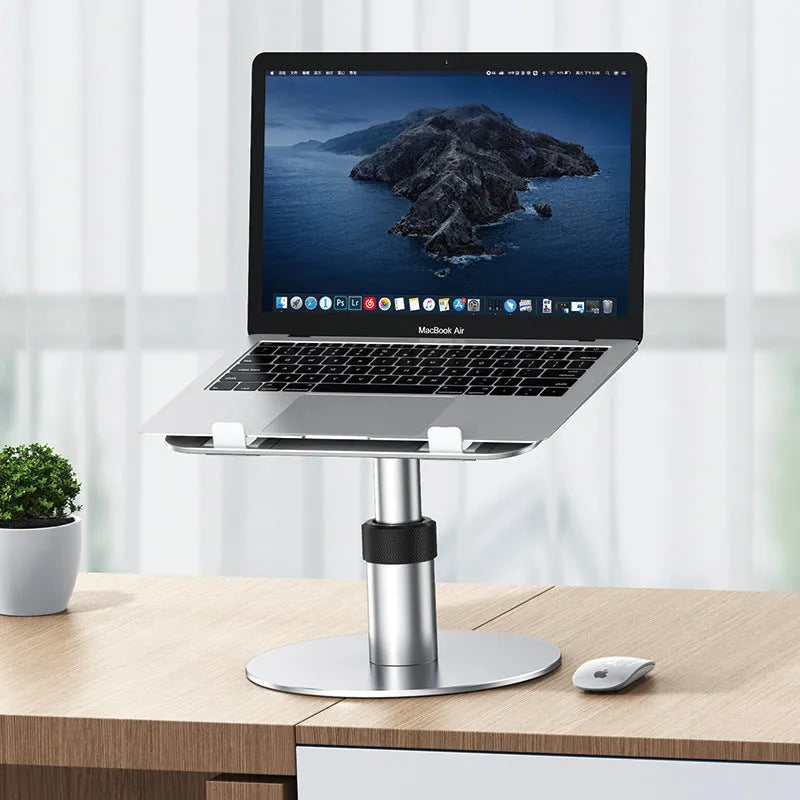 Silver adjustable aluminium car laptop stand with rotating base shown supporting a laptop.