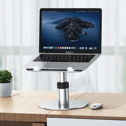Silver adjustable aluminium car laptop stand with rotating base shown supporting a laptop.
