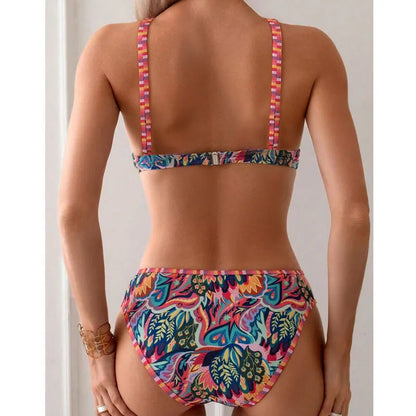 Women's printed halter neck swimsuit top and swim pants in a mixed colour pattern.