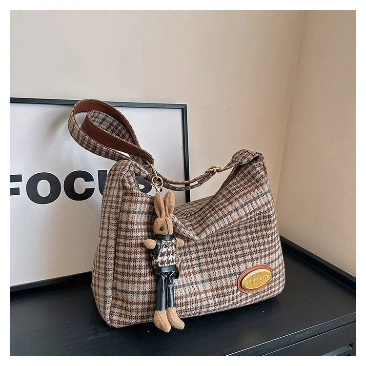 Women's large capacity woolen shoulder bag in brown with pendant attachment for autumn and winter use