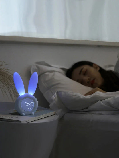 Adorable bunny-eared digital alarm clock with LED display, sound control, and magnetic design