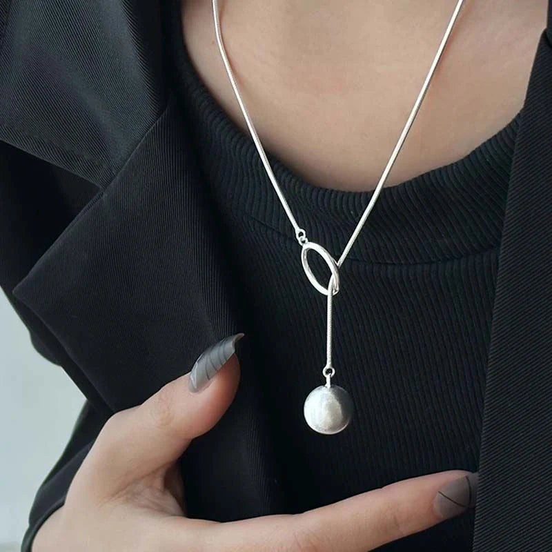 Elegant platinum-plated round ball chain necklace with sleek snake-bone design, a timeless fashion accessory for modern women.