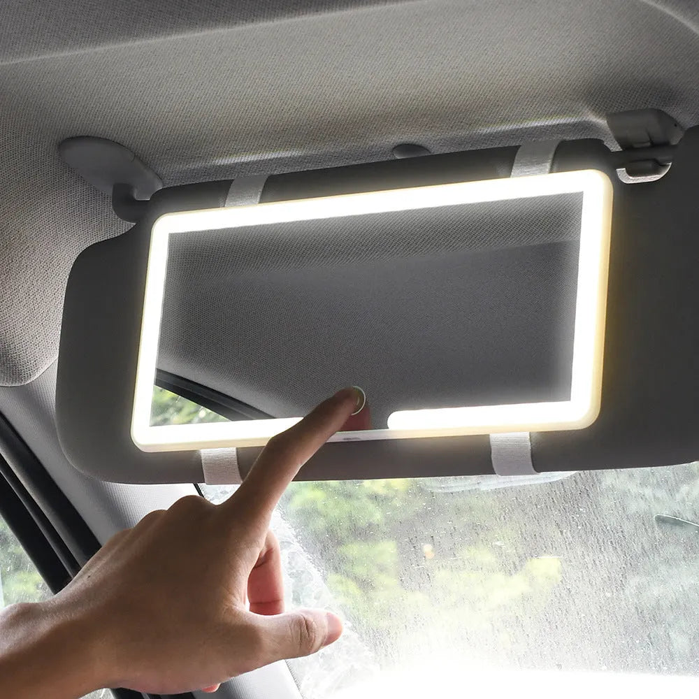 Automotive LED makeup mirror mounted on a car sun visor, showing its slim profile and large reflective surface.