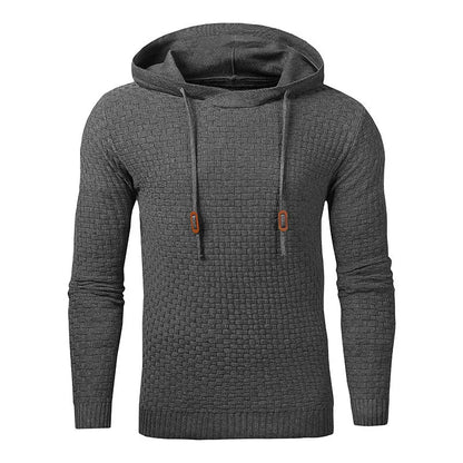 A man wearing a cotton-polyester blend hoodie available in nine colours including black, navy, and red.
