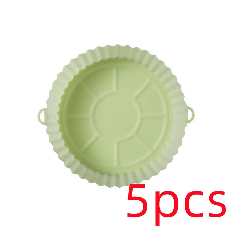 Round blue silicone baking tray mat with 4.5cm sides on a kitchen counter.