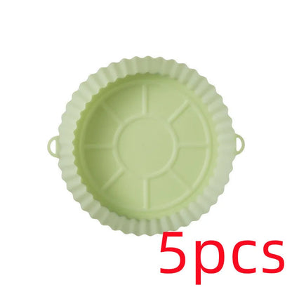 Round blue silicone baking tray mat with 4.5cm sides on a kitchen counter.