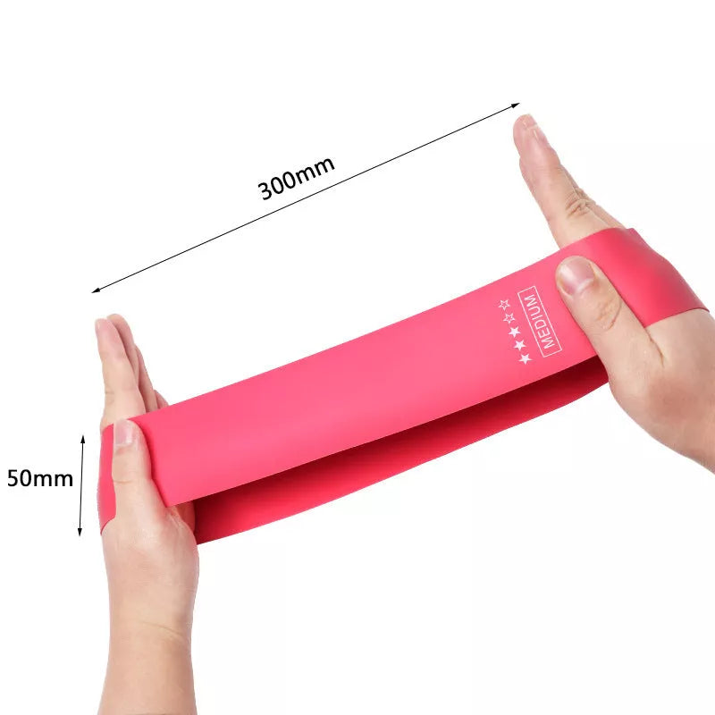 Yoga tension band set in five colours with varying resistance levels for fitness and Pilates