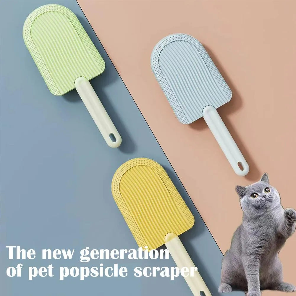 Foldable blue pet grooming brush with silicone teeth on a white background