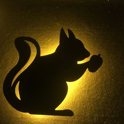 A stylish cat-themed LED lamp that automatically lights up when it detects sound, creating a cozy, ambient glow in a room.