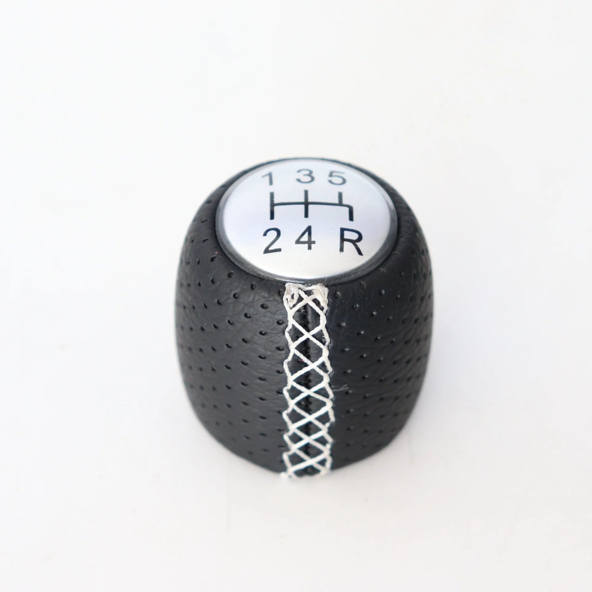 Sewn wrapped leather perforated style handball gear knob for Alpha vehicles in black, red, and white colour options.