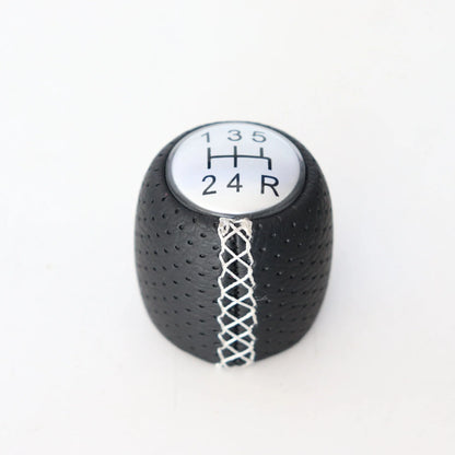 Sewn wrapped leather perforated style handball gear knob for Alpha vehicles in black, red, and white colour options.