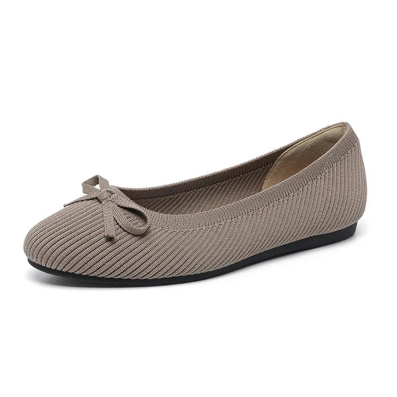 Women's round toe flat pumps with bow detail in butterfly colours showing fabric upper and shallow mouth opening