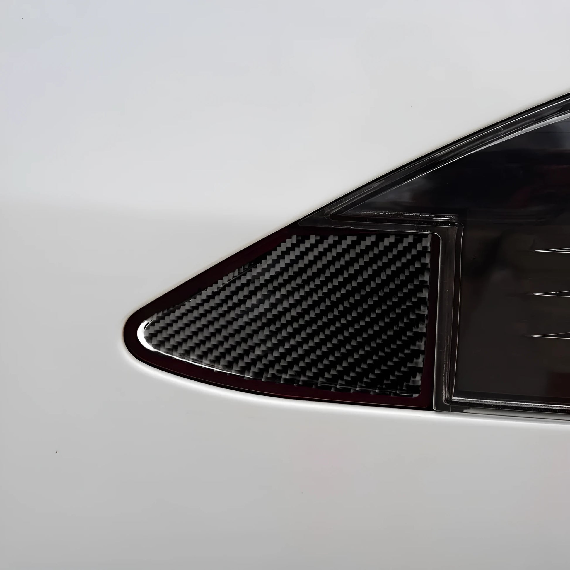 Carbon fibre decorative sticker for car USB charging port panel with 3M adhesive backing.