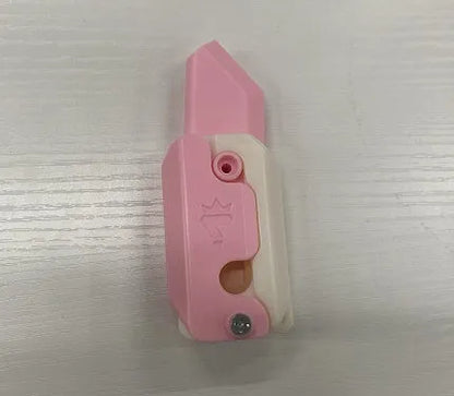 3D printed plastic carrot fidget knife with retractable blade, shown in orange and green colour scheme.