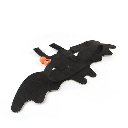 Halloween costume for a cat featuring batwing sleeves, made from felt, in orange pumpkin bat design.