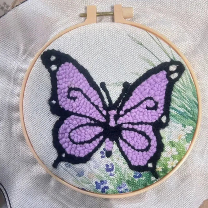 Beginner embroidery craft suit showing six cartoon designs including turtle, sheep, horse, fox, butterfly, and mermaid patterns
