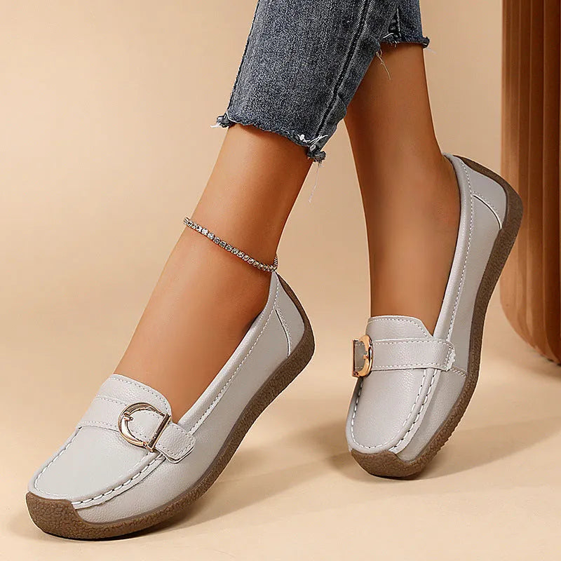 Women's beige casual loafers with a round toe and shallow-cut vamp on a beef tendon sole.
