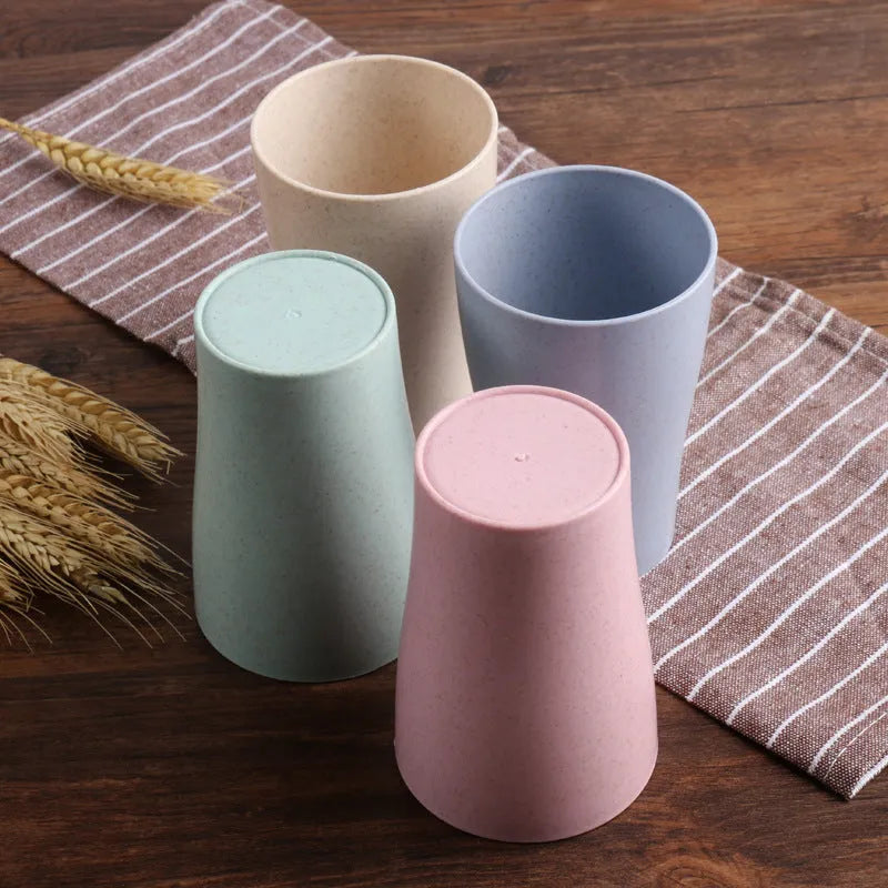 A cylindrical wheat straw plastic bathroom cup in a Nordic colour, holding toothbrushes.