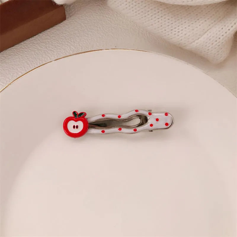 Red love heart-shaped hair barrette clip with retro white dots on a willow leaf-shaped base.