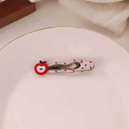 Red love heart-shaped hair barrette clip with retro white dots on a willow leaf-shaped base.