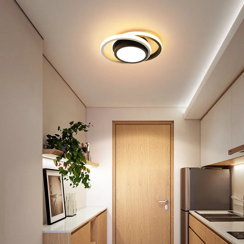 Modern geometric aluminium ceiling light in round and square styles with LED illumination.
