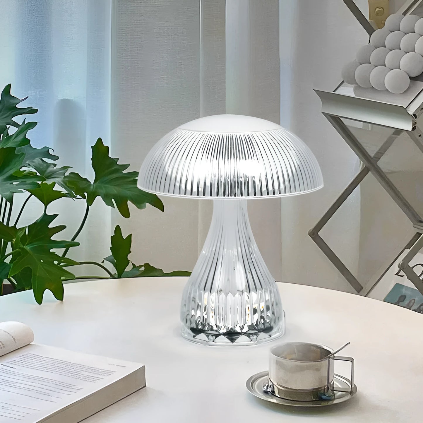 Small white acrylic USB rechargeable table lamp with a three-colour LED light.