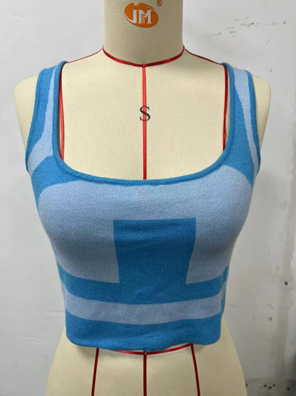 Women's white U-neck slim fit camisole vest with a crop hem, on a mannequin.
