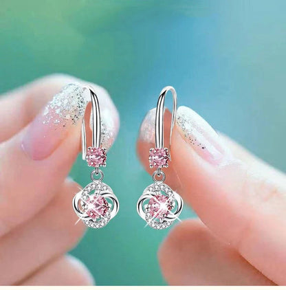 Silver stud earrings with four-leaf clover design and fairy ear hooks