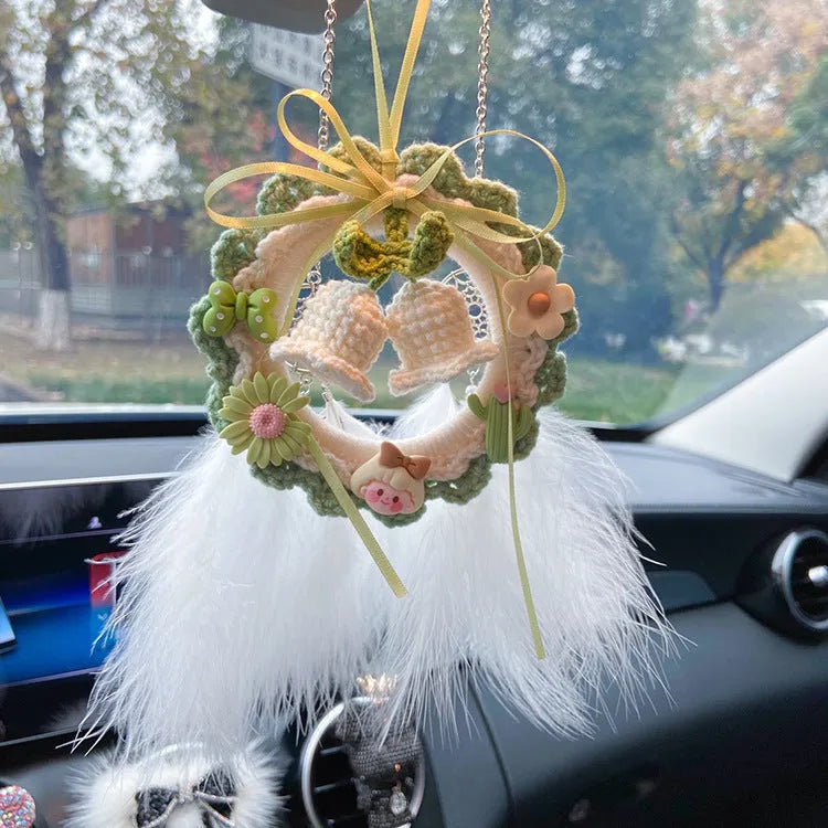Green woven wool bell orchid car pendant hanging, showing handmade texture and fresh style.